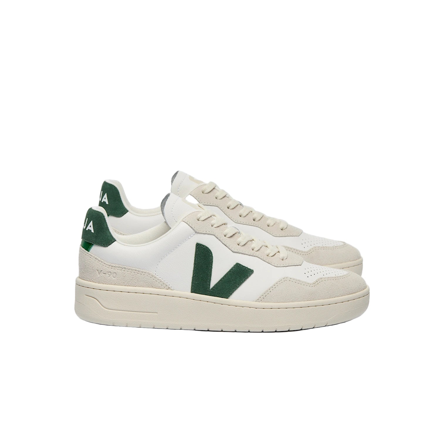 White sneakers with green accents on a white background