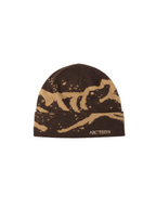 Brown beanie with beige logo and text on a light gray background