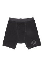 A pair of black Supima rib boxer briefs with a elastic waistband and a small text logo on the left leg.